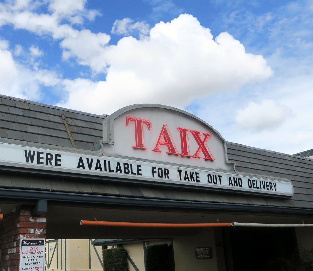 Taix takeout sign after coronavirus restrictions
